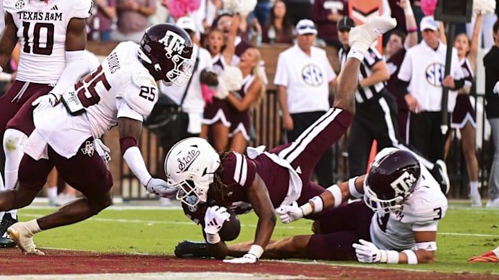 Mississippi State Bulldogs wide receiver Kevin Coleman Jr. (3) dives into the endzone against Texas A&M Aggies defensive back Dalton Brooks (25) during the fourth quarter at Davis Wade Stadium at Scott Field. Mississippi State Bulldogs wide receiver Kevin Coleman Jr. (3) dives into the endzone against Texas A&M Aggies defensive back Dalton Brooks (25) during the fourth quarter at Davis Wade Stadium at Scott Field.