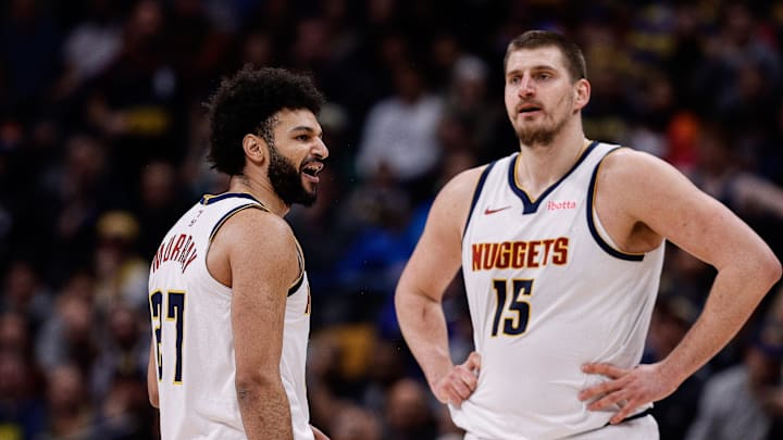 Feb 10, 2025; Denver, Colorado, USA; Denver Nuggets guard Jamal Murray (27) reacts after a call as center Nikola Jokic (15) looks on in the third quarter against the Portland Trail Blazers at Ball Arena. Mandatory Credit: Isaiah J. Downing-Imagn Images