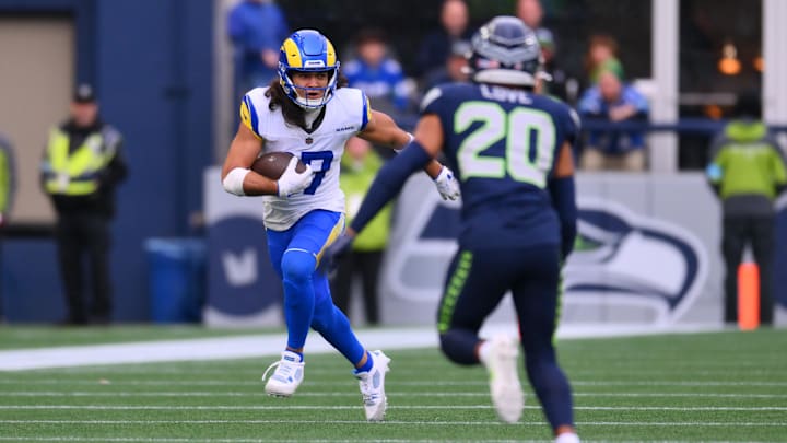 Nov 3, 2024; Seattle, Washington, USA; Los Angeles Rams wide receiver Puka Nacua (17) carries the ball after a catch against the Seattle Seahawks during the first half at Lumen Field.