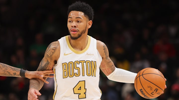 Jan 17, 2026; Atlanta, Georgia, USA; Boston Celtics guard Anfernee Simons (4) dribbles against the Atlanta Hawks in the fourth quarter at State Farm Arena. Mandatory Credit: Brett Davis-Imagn Images