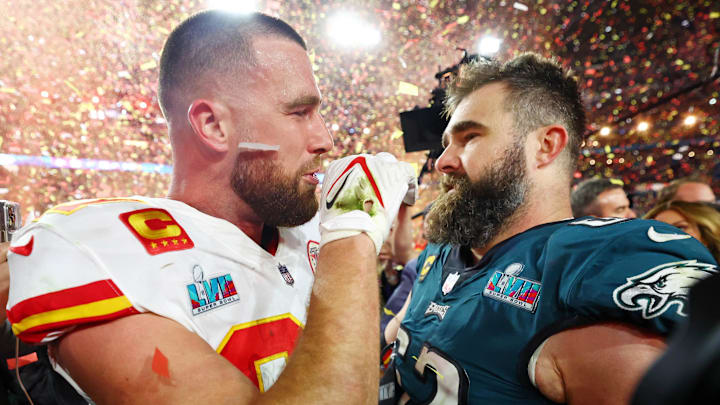 Feb 12, 2023; Glendale, Arizona, US; Kansas City Chiefs tight end Travis Kelce (87) talks with his brother Philadelphia Eagles center Jason Kelce (62) after he won Super Bowl LVII at State Farm Stadium. Mandatory Credit: Mark J. Rebilas-Imagn Images