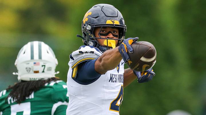 Sep 6, 2025; Athens, Ohio, USA; West Virginia Mountaineers wide receiver Cam Vaughn (4) celebrates a first down after a catch during the first quarter against the Ohio Bobcats at Peden Stadium. Mandatory Credit: Ben Queen-Imagn Images