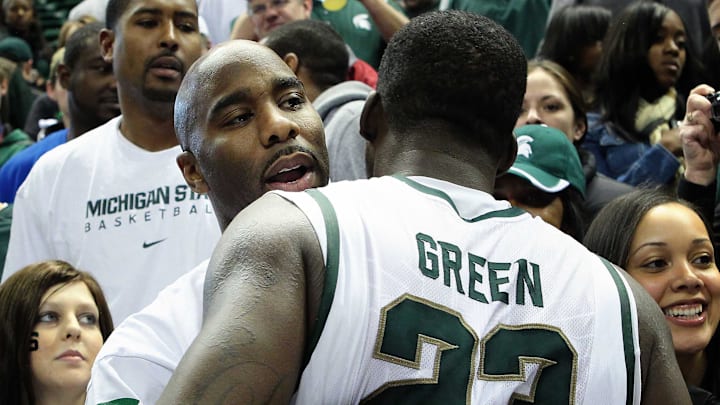 February 5, 2012; East Lansing, MI, USA; Michigan State Spartans former Mateen Cleaves congratulates forward Draymond Green (23) after game at Jack Breslin Students Events Center. MSU won 64-54.   Mandatory Credit: Mike Carter-Imagn Images