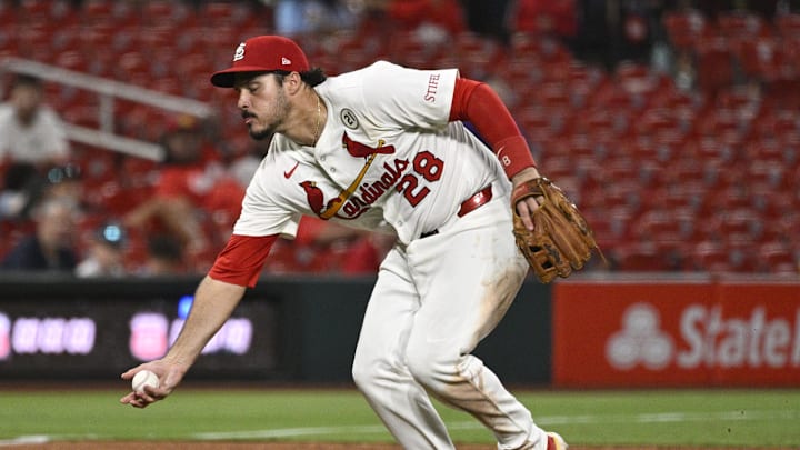 Sep 15, 2025; St. Louis, Missouri, USA; St. Louis Cardinals third baseman Nolan Arenado (28) fields a ground ball hit by Cincinnati Reds third baseman Santiago Espinal (not pictured) in the ninth inning at Busch Stadium. Mandatory Credit: Joe Puetz-Imagn Images