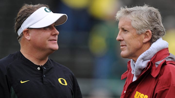 Oct 31, 2009; Eugene, OR, USA; Oregon Ducks coach Chip Kelly (left) and Southern California Trojans coach Pete Carroll (right) before the game at Autzen Stadium. Mandatory Credit: Kirby Lee/Image of Sport-Imagn Images Oct 31, 2009; Eugene, OR, USA; Oregon Ducks coach Chip Kelly (left) and Southern California Trojans coach Pete Carroll (right) before the game at Autzen Stadium. Mandatory Credit: Kirby Lee/Image of Sport-Imagn Images