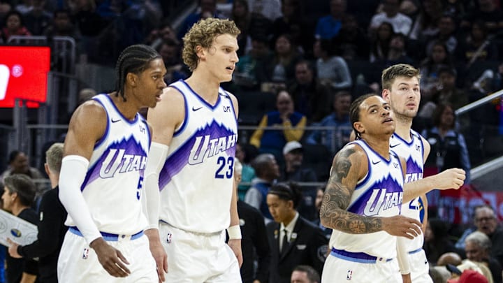 Jan 3, 2026; San Francisco, California, USA;  Utah Jazz forward Cody Williams (5) and forward Lauri Markkanen (23) and guard Keyonte George (3) and center Walker Kessler (24) walk off the court during a time out in the second quarter against the Golden State Warriors at Chase Center. Mandatory Credit: John Hefti-Imagn Images