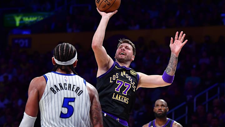 Feb 24, 2026; Los Angeles, California, USA; Los Angeles Lakers guard Luka Doncic (77) shoots against Orlando Magic forward Paolo Banchero (5) during the second half at Crypto.com Arena. Mandatory Credit: Gary A. Vasquez-Imagn Images Feb 24, 2026; Los Angeles, California, USA; Los Angeles Lakers guard Luka Doncic (77) shoots against Orlando Magic forward Paolo Banchero (5) during the second half at Crypto.com Arena. Mandatory Credit: Gary A. Vasquez-Imagn Images