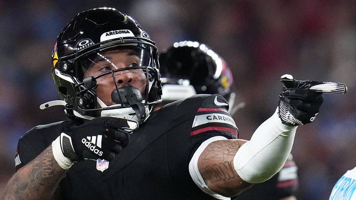 Arizona Cardinals running back James Conner (6) signals his own first down against the Chargers in 2024.