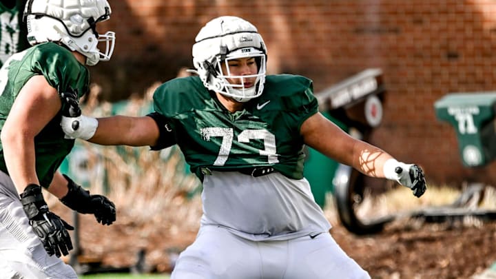 Michigan State offensive lineman Rustin Young, right, and Stanton Ramil work out during football practice on Tuesday, April 8, 2025, in East Lansing.