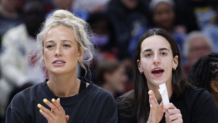 Jun 7, 2025; Chicago, Illinois, USA; Injured Indiana Fever guard Sophie Cunningham (8) and guard Caitlin Clark (22) react from the bench during the first half of a WNBA game against the Chicago Sky at United Center. Mandatory Credit: Kamil Krzaczynski-Imagn Images