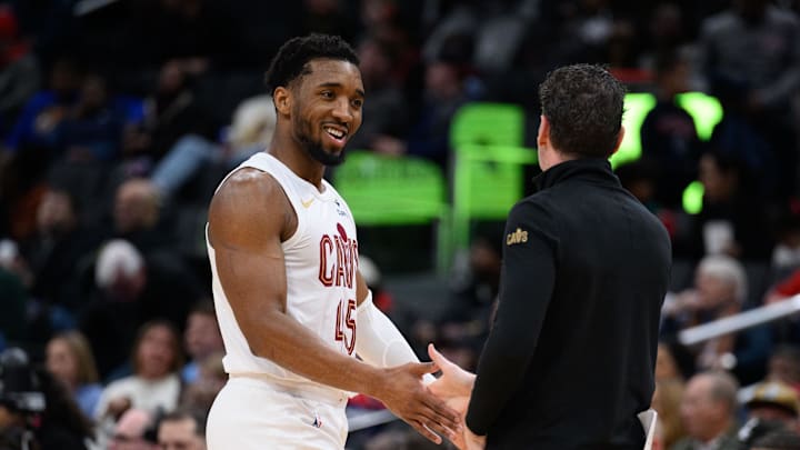 Feb 7, 2025; Washington, District of Columbia, USA; Cleveland Cavaliers guard Donovan Mitchell (45) reacts on the sideline with Cleveland Cavaliers head coach Kenny Atkinson during the second quarter against the Washington Wizards at Capital One Arena. Mandatory Credit: Reggie Hildred-Imagn Images