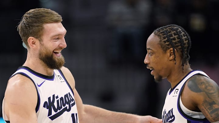 Dec 6, 2024; San Antonio, Texas, USA; Sacramento Kings center Domantas Sabonis (11) and forward DeMar DeRozan (10) embrace before a game the San Antonio Spurs at Frost Bank Center. Mandatory Credit: Scott Wachter-Imagn Images