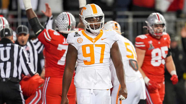Tennessee defensive lineman Jayson Jenkins (97) and Tennessee defensive lineman James Pearce Jr. (27) walk off after Ohio State scores a touchdown in the final minutes of the third quarter during a College Football Playoff first round game between Tennessee and Ohio State held at Ohio Stadium in Columbus, Ohio, on Saturday, Dec. 21, 2024. Tennessee defensive lineman Jayson Jenkins (97) and Tennessee defensive lineman James Pearce Jr. (27) walk off after Ohio State scores a touchdown in the final minutes of the third quarter during a College Football Playoff first round game between Tennessee and Ohio State held at Ohio Stadium in Columbus, Ohio, on Saturday, Dec. 21, 2024.