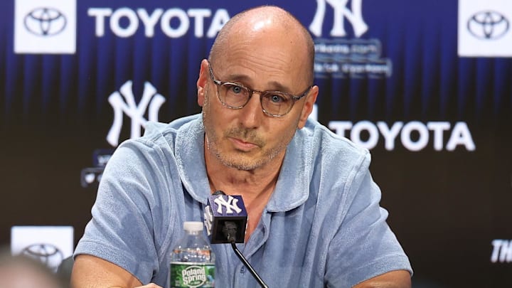 Aug 23, 2023; Bronx, New York, USA; New York Yankees general manager Brian Cashman talks with the media before the game between the Yankees and the Washington Nationals at Yankee Stadium. Mandatory Credit: Vincent Carchietta-Imagn Images