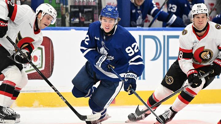 Sep 23, 2026; Toronto, Ontario, CAN;  Toronto Maple Leafs forward Gavin McKenna (92) is tripped by the stick of Ottawa Senators forward Philippe Daoust (92) as forward Kasperi Halttunen (68) skates by in the third period at Scotiabank Arena.  Mandatory Credit: Dan Hamilton-Imagn Images