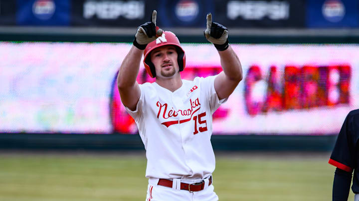 Dylan Carey points to the dugout after his double to score Moyer in the first inning against Omaha.