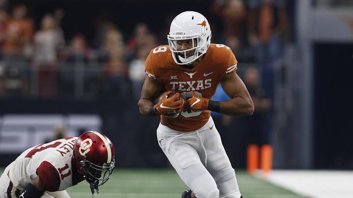 Texas Longhorns wide receiver Collin Johnson runs against Oklahoma Sooners cornerback Parnell Motley in the second quarter in the Big 12 championship game at AT&T Stadium. Texas Longhorns wide receiver Collin Johnson runs against Oklahoma Sooners cornerback Parnell Motley in the second quarter in the Big 12 championship game at AT&T Stadium.