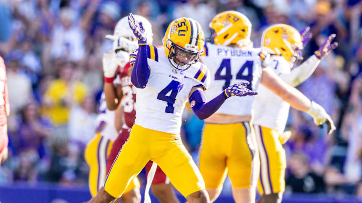 Nov 15, 2025; Baton Rouge, Louisiana, USA;  LSU Tigers cornerback Mansoor Delane (4) reacts to a stop on fourth down against the Arkansas Razorbacks during the second half at Tiger Stadium. Mandatory Credit: Stephen Lew-Imagn Images