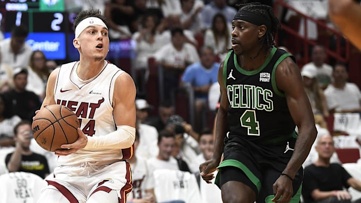 Apr 29, 2024; Miami, Florida, USA; Miami Heat guard Tyler Herro (14) looks for a shot against Boston Celtics guard Jrue Holiday (4) during the first quarter of game four of the first round for the 2024 NBA playoffs at Kaseya Center. Mandatory Credit: Michael Laughlin-Imagn Images