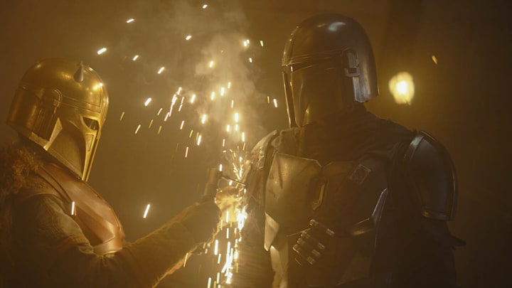 The Armorer (Emily Swallow) and Din Djarin (Pedro Pascal) in Star Wars The Mandalorian "Chapter 8: Redemption." Image Credit: starwars.com