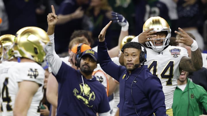 Jan 2, 2025; New Orleans, LA, USA; Notre Dame Fighting Irish head coach Marcus Freeman celebrates on the sidelines in the final minute against the Georgia Bulldogs during the fourth quarter at Caesars Superdome