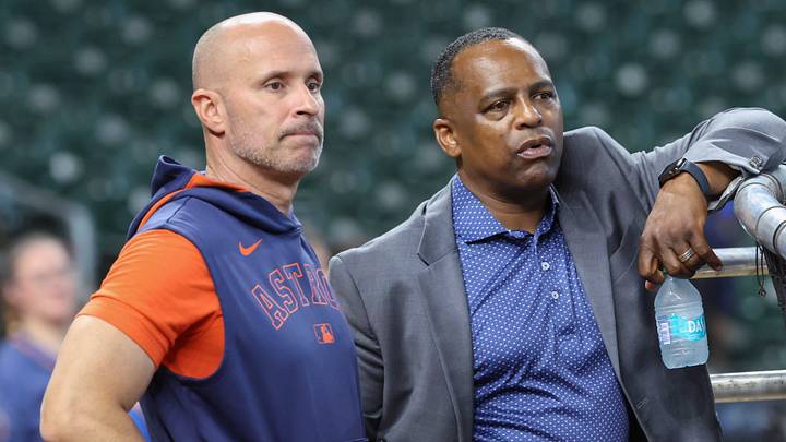 Jun 28, 2025; Houston, Texas, USA; Houston Astros manager Joe Espada (left) and general manager Dana Brown (right) talk on the field before the game against the Chicago Cubs at Daikin Park. Mandatory Credit: Troy Taormina-Imagn Images