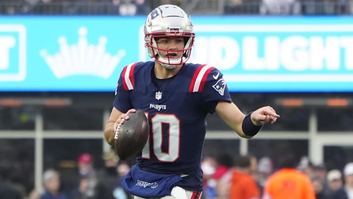 Dec 28, 2024; Foxborough, Massachusetts, USA; New England Patriots quarterack Drake Maye (10) rolls out to throw the ball against the Los Angeles Chargers during the second half at Gillette Stadium. Mandatory Credit: Gregory Fisher-Imagn Images