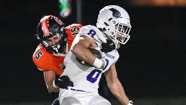 Grafton's Tyler Heinle (15) pulls down Stoughton's Mason Richter (8) after a short catch in a WIAA Division 3 state semifinal Friday, November 10, 2023, at Waukesha West High School in Waukesha, Wisconsin.
