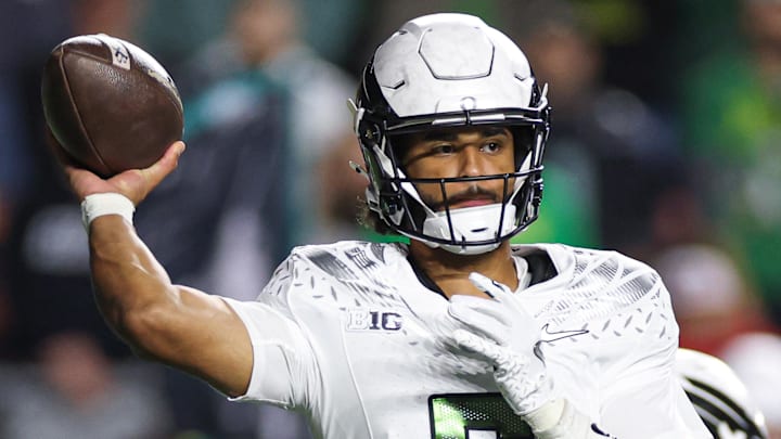 Oct 18, 2025; Piscataway, New Jersey, USA;  Oregon Ducks quarterback Dante Moore (5) throws the ball during the first half against the Rutgers Scarlet Knights at SHI Stadium. Mandatory Credit: Vincent Carchietta-Imagn Images