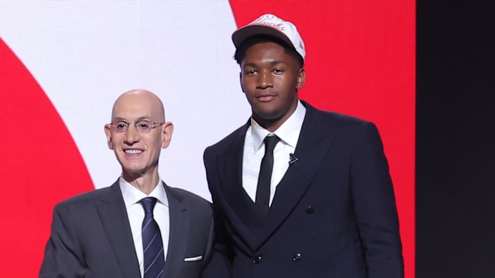 Jun 25, 2025; Brooklyn, NY, USA; Derik Queen stands with NBA commissioner Adam Silver after being selected as the 13th pick by the Atlanta Hawks in the first round of the 2025 NBA Draft at Barclays Center.