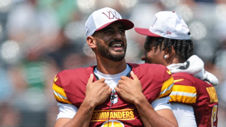 Aug 10, 2024; East Rutherford, New Jersey, USA; Washington Commanders quarterback Marcus Mariota (0) looks on during the first half against the New York Jets at MetLife Stadium. Mandatory Credit: Vincent Carchietta-Imagn Images Aug 10, 2024; East Rutherford, New Jersey, USA; Washington Commanders quarterback Marcus Mariota (0) looks on during the first half against the New York Jets at MetLife Stadium. Mandatory Credit: Vincent Carchietta-Imagn Images