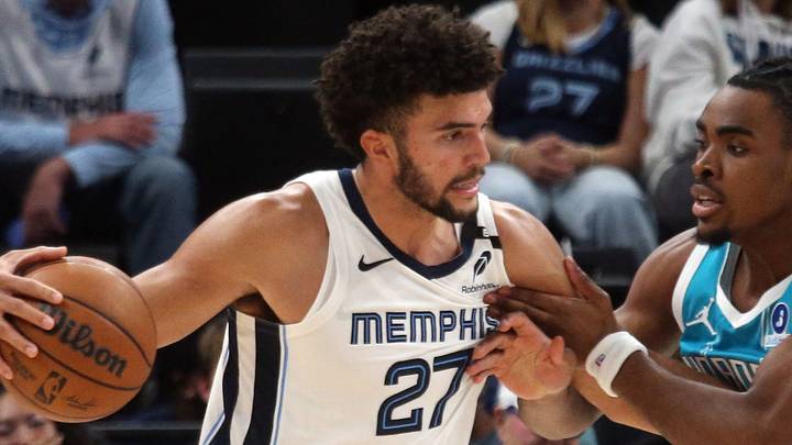 Oct 16, 2026; Memphis, Tennessee, USA; Memphis Grizzlies forward Cameron Boozer (27) drives to the basket as Charlotte Hornets forward Micheal Ajayi (10) defends during the fourth quarter at FedExForum. Mandatory Credit: Petre Thomas-Imagn Images Oct 16, 2026; Memphis, Tennessee, USA; Memphis Grizzlies forward Cameron Boozer (27) drives to the basket as Charlotte Hornets forward Micheal Ajayi (10) defends during the fourth quarter at FedExForum. Mandatory Credit: Petre Thomas-Imagn Images