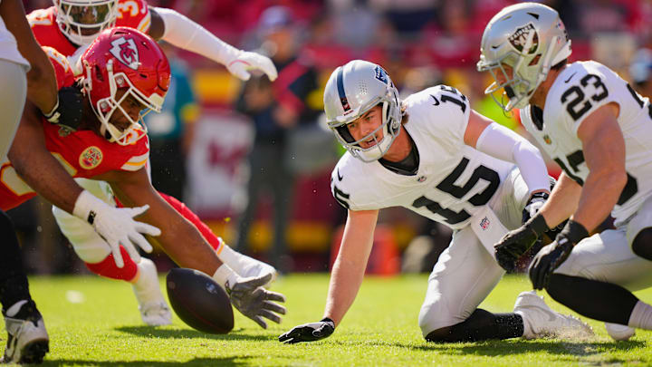 Oct 19, 2025; Kansas City, Missouri, USA; Kansas City Chiefs defensive tackle Jerry Tillery (99) recovers a fumble by Las Vegas Raiders quarterback Kenny Pickett (15) during the fourth quarter of the game at GEHA Field at Arrowhead Stadium. Mandatory Credit: Jay Biggerstaff-Imagn Images