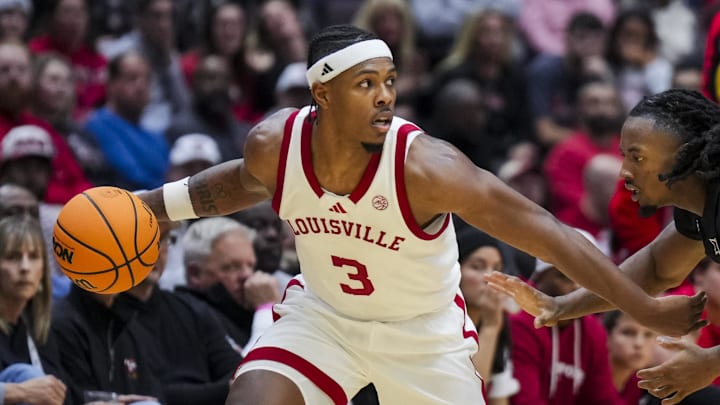 Nov 21, 2025; Cincinnati, Ohio, USA; Louisville Cardinals guard Ryan Conwell (3) dribbles the ball against Cincinnati Bearcats guard Day Day Thomas (1) in the second half at Heritage Bank Center. Mandatory Credit: Aaron Doster-Imagn Images Nov 21, 2025; Cincinnati, Ohio, USA; Louisville Cardinals guard Ryan Conwell (3) dribbles the ball against Cincinnati Bearcats guard Day Day Thomas (1) in the second half at Heritage Bank Center. Mandatory Credit: Aaron Doster-Imagn Images