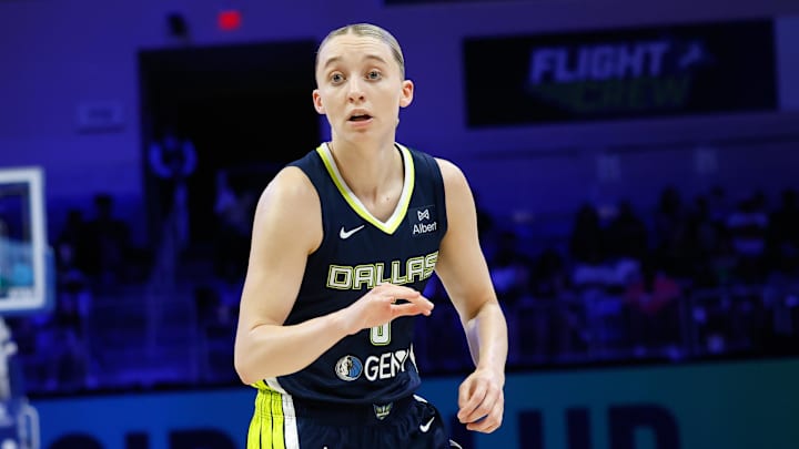 Jul 16, 2025; Arlington, Texas, USA;  Dallas Wings guard Paige Bueckers (5) reacts against the Las Vegas Aces during the second half at College Park Center. Mandatory Credit: Chris Jones-Imagn Images