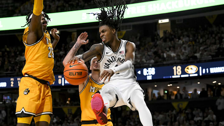 Vanderbilt Commodores guard Jason Edwards (1) passes the ball as Missouri Tigers guard Jacob Crews (35) defends during the first half at Memorial Gymnasium. Vanderbilt Commodores guard Jason Edwards (1) passes the ball as Missouri Tigers guard Jacob Crews (35) defends during the first half at Memorial Gymnasium.