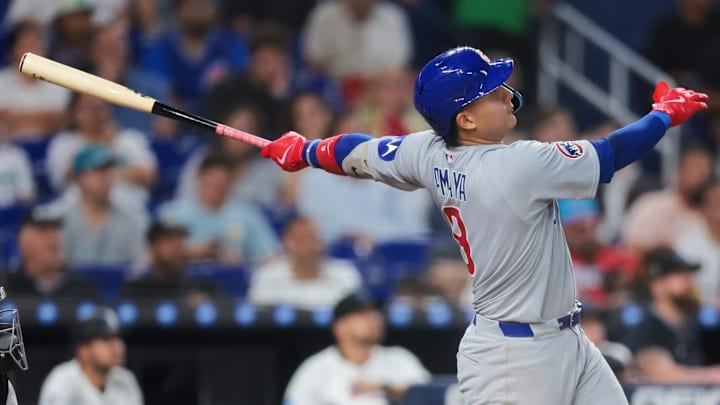 May 19, 2025; Miami, Florida, USA; Chicago Cubs catcher Miguel Amaya (9) hits a three-run home run against the Miami Marlins during the fourth inning at loanDepot Park. 
