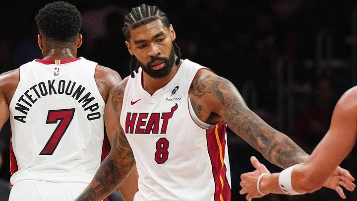 Miami Heat center Nick Richards (8) congratulates guard Klay Thompson (11) during a timeout (Mandatory Credit: Jim Rassol-Imagn Images)