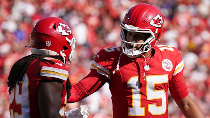 Sep 28, 2025; Kansas City, Missouri, USA;  Kansas City Chiefs quarterback Patrick Mahomes (15) speaks with Kansas City Chiefs running back Kareem Hunt (29) during the second quarter against the Baltimore Ravens at GEHA Field at Arrowhead Stadium. Mandatory Credit: Denny Medley-Imagn Images
