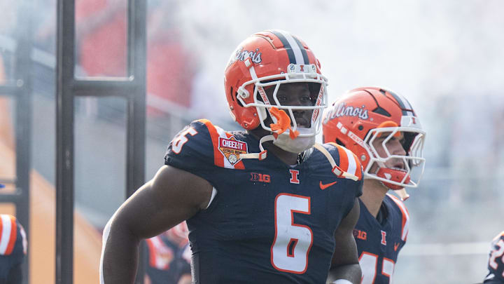 Dec 31, 2024; Orlando, FL, USA; Illinois Fighting Illini running back Josh McCray (6) runs out of the tunnel before the game against the South Carolina Gamecocks at Camping World Stadium. Mandatory Credit: Jeremy Reper-Imagn Images