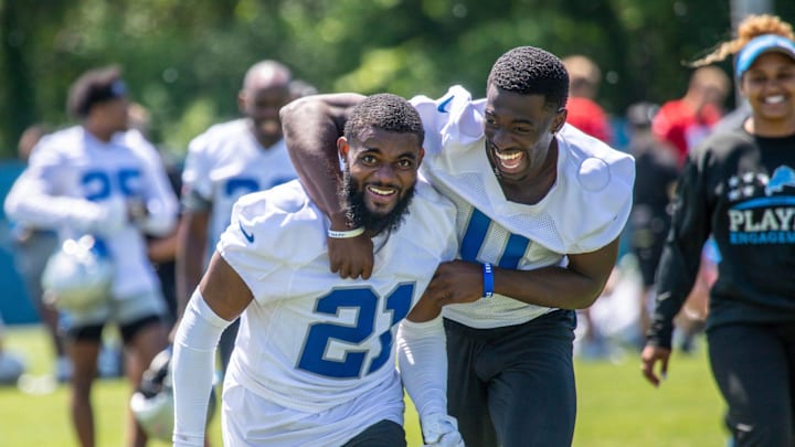 Detroit Lions cornerbacks Amik Robertson (21) and Terrion Arnold (0) run off the field after the Detroit Lions OTA's