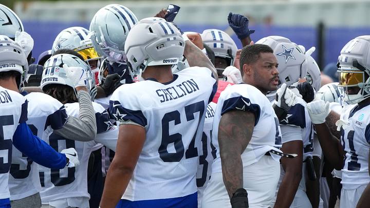Dallas Cowboys players huddle during a joint practice against the Los Angeles Ramsat the Rams Practice Facility.
