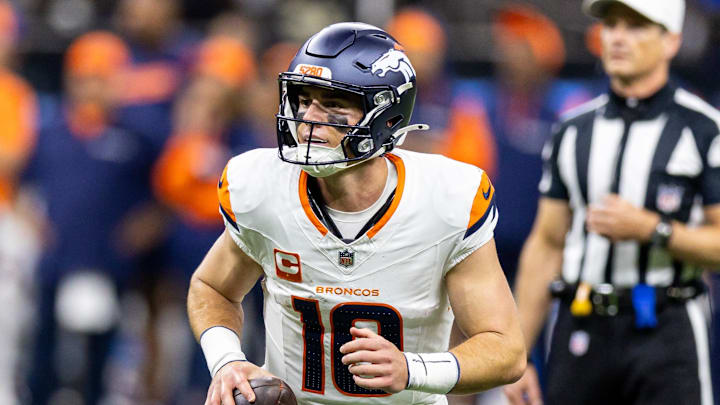 Oct 17, 2024; New Orleans, Louisiana, USA;  Denver Broncos quarterback Bo Nix (10) looks to pas downfield against the New Orleans Saints during the first half at Caesars Superdome. Mandatory Credit: Stephen Lew-Imagn Images