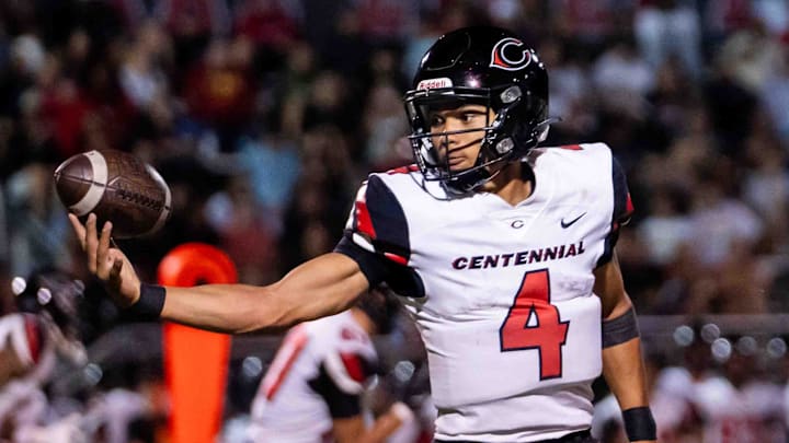 Centennial Huskies Quarterback Husan Longstreet (4) catches the ball at Liberty High School on Sept. 21, 2024, in Peoria.
