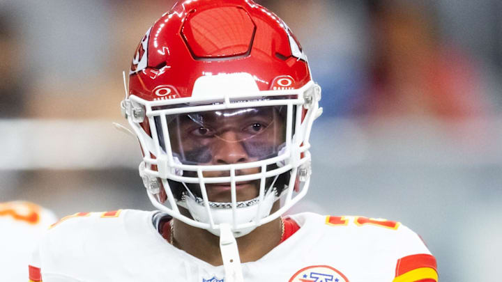 Aug 9, 2025; Glendale, Arizona, USA; Kansas City Chiefs running back Elijah Mitchell (25) against the Arizona Cardinals during a preseason NFL game at State Farm Stadium.