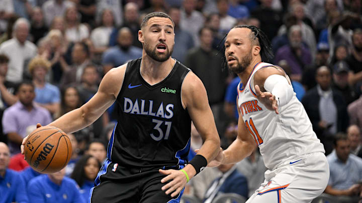 Nov 19, 2025; Dallas, Texas, USA; Dallas Mavericks guard Klay Thompson (31) drives to the basket past New York Knicks guard Jalen Brunson (11) during the first quarter at the American Airlines Center. Mandatory Credit: Jerome Miron-Imagn Images