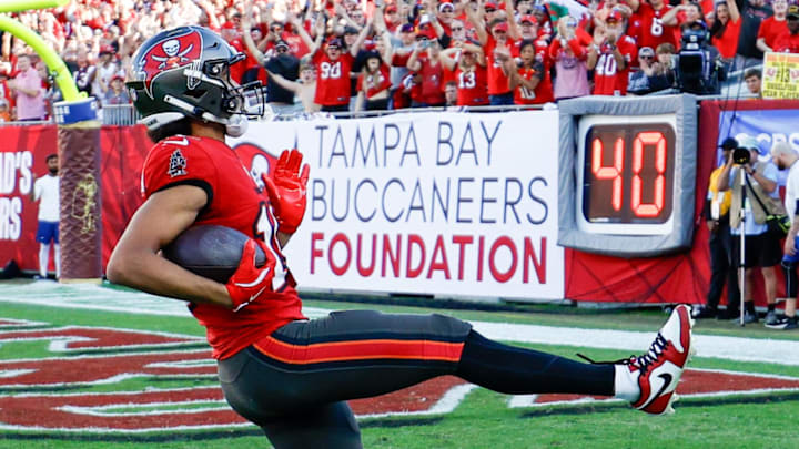 Dec 8, 2024; Tampa, Florida, USA; Tampa Bay Buccaneers wide receiver Jalen McMillan (15) scores a touchdown against the Las Vegas Raiders in the fourth quarter at Raymond James Stadium. Mandatory Credit: Nathan Ray Seebeck-Imagn Images
