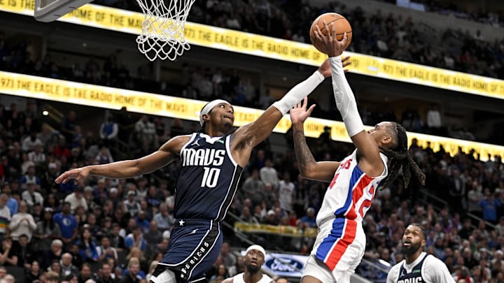 Dec 18, 2025; Dallas, Texas, USA; Detroit Pistons guard Daniss Jenkins (24) is fouled by Dallas Mavericks guard Brandon Williams (10) during the second half at the American Airlines Center. Mandatory Credit: Jerome Miron-Imagn Images