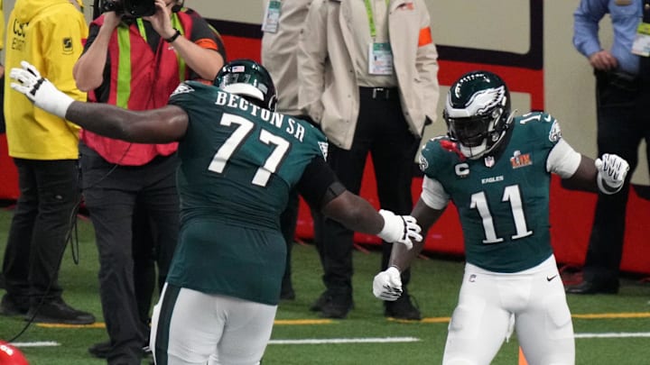 Feb 9, 2025; New Orleans, LA, USA; Philadelphia Eagles wide receiver A.J. Brown (11) reacts with offensive tackle Mekhi Becton (77) after making a touchdown catch against the Kansas City Chiefs during the second quarter in Super Bowl LIX at Caesars Superdome. 