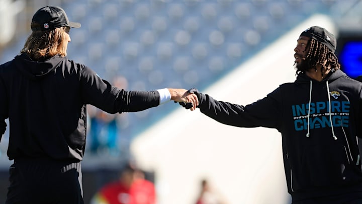 Jacksonville Jaguars quarterback Trevor Lawrence (16), left, shakes hands with wide receiver Jakobi Meyers (3) before an NFL football matchup at EverBank Stadium, Sunday, Dec. 14, 2025, in Jacksonville, Fla. [Corey Perrine/Florida Times-Union]